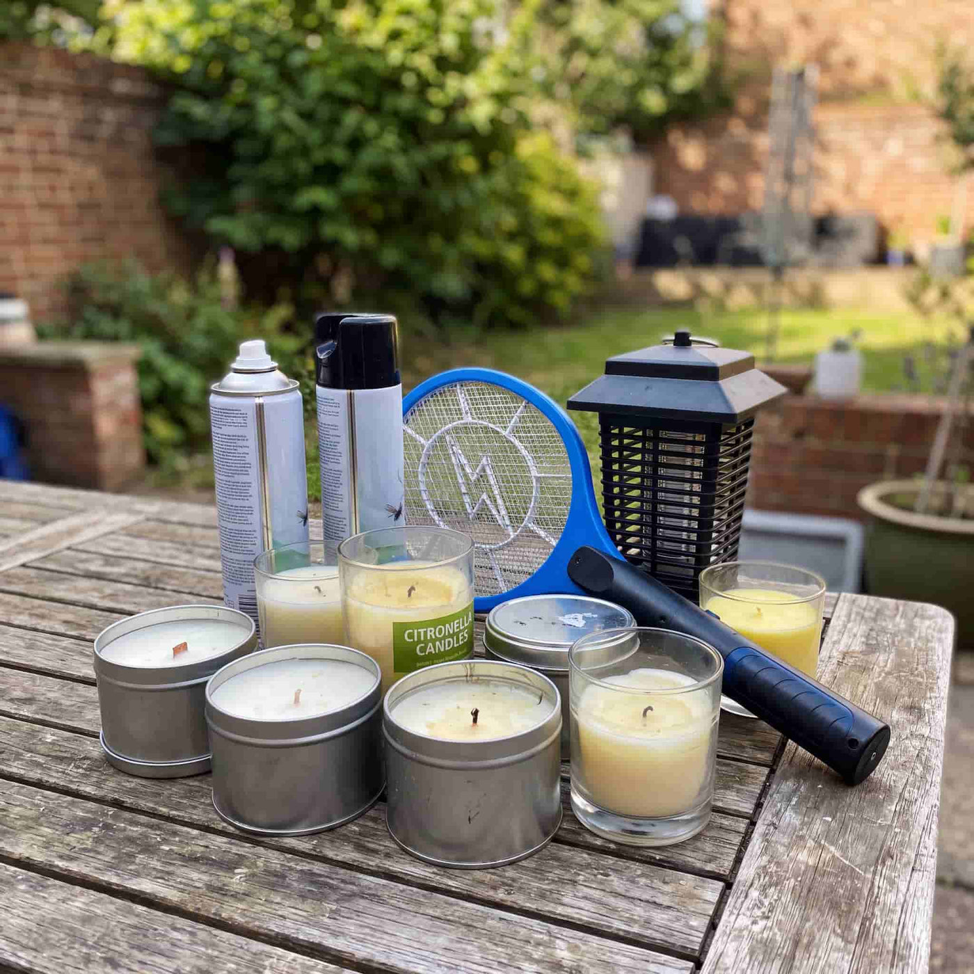 A pile of failed fly-control products on a patio table